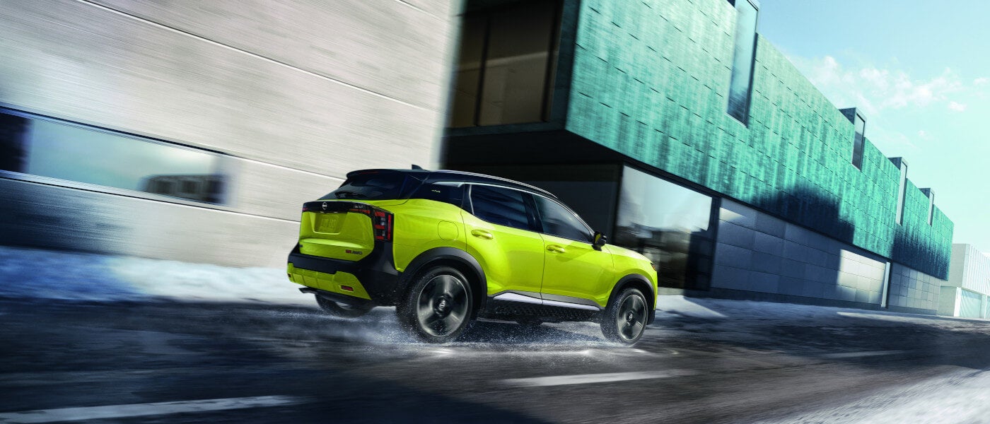 2025 Nissan Kicks driving on snowy road