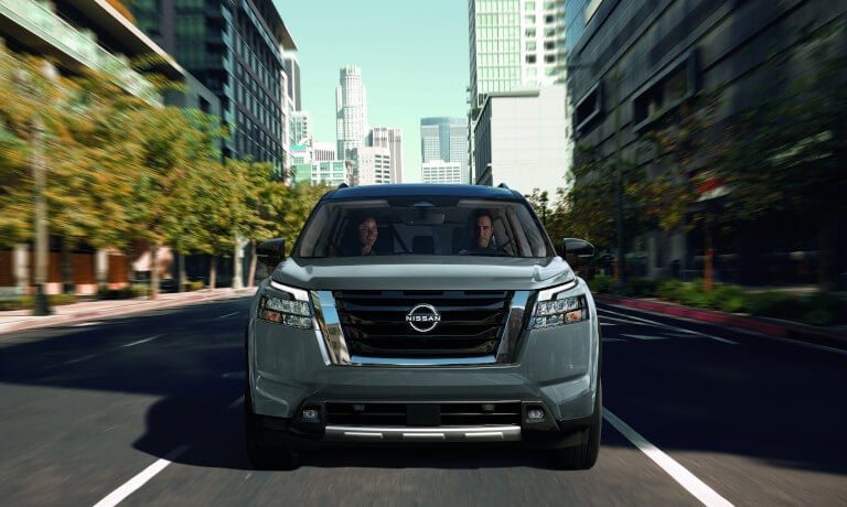 2025 Nissan Pathfinder driving head-on in city