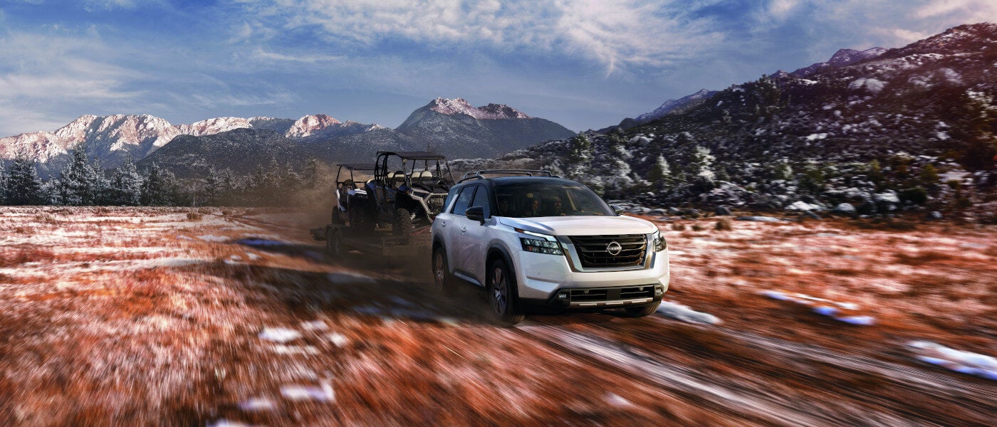 2025 Nissan Pathfinder towing ATVs in mountains