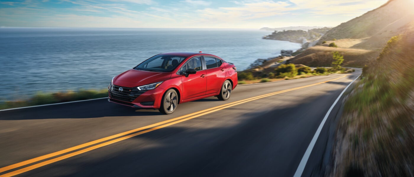 2025 Nissan Versa driving seaside