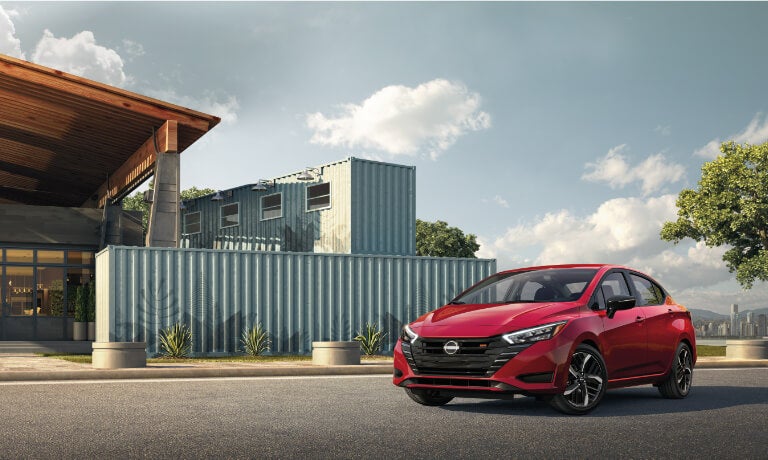 2025 Nissan Versa parked by a building