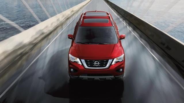 Nissan Pathfinder driving on a bridge